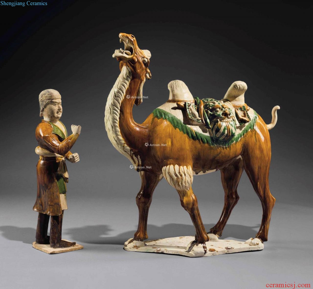 The tang dynasty (618-907), A MAGNIFICENT SANCAI - GLAZED POTTERY FIGURE OF A BACTRIAN CAMEL AND A FOREIGN unapologetically