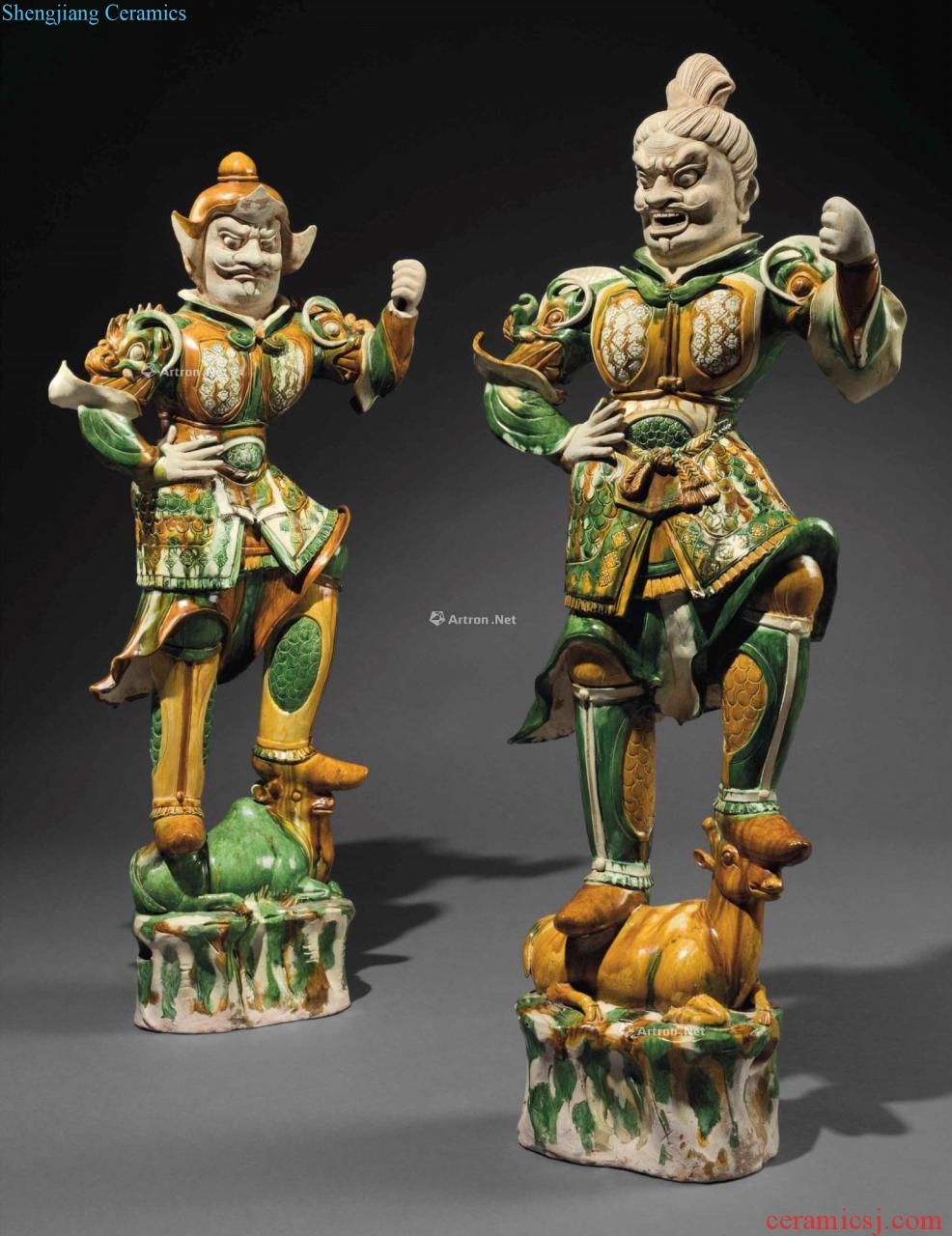 The tang dynasty (618-907), AN EXCEPTIONAL PAIR OF MASSIVE SANCAI - GLAZED POTTERY GUARDIAN FIGURES