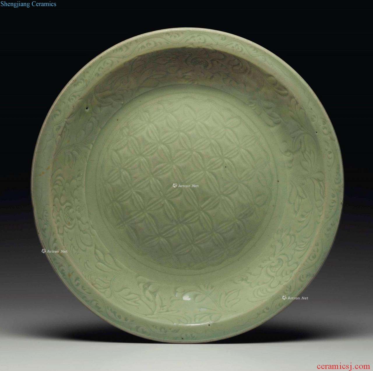 In the Ming dynasty (1368-1644), A LARGE LONGQUAN CELADON CARVED DISH