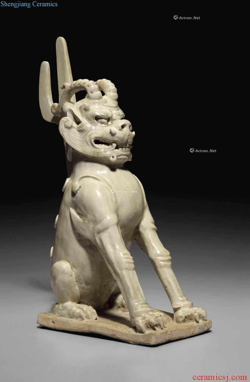 The sui dynasty (A.D. 581-581) A STRAW - GLAZED STONEWARE FIGURE OF AN EARTH SPIRIT