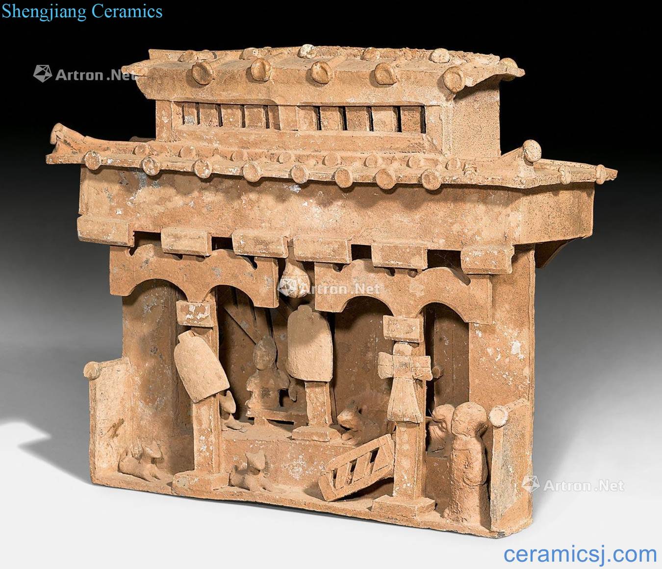 In the early han dynasty pottery building model with RenYong animal figurines