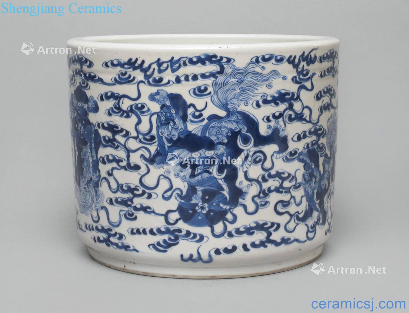 The 19th/20th century blue and white cloud lion grain brush pot