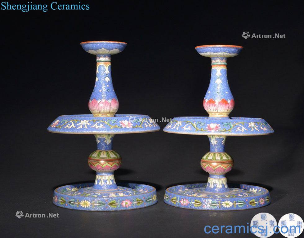 The QING DYNASTY A PAIR OF BLUE - GROUND FAMILLE ROSE - CANDLESTICKS