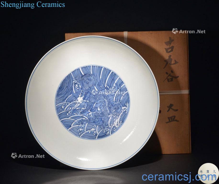The QING DYNASTY A LARGE BLUE AND WHITE DRAGON DISH