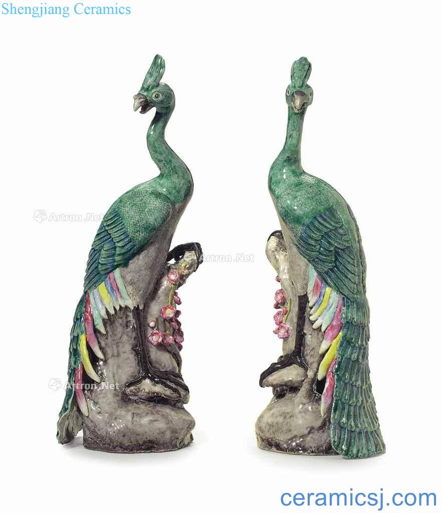 In the 19th century A PAIR OF FAMILLE ROSE PEACOCKS