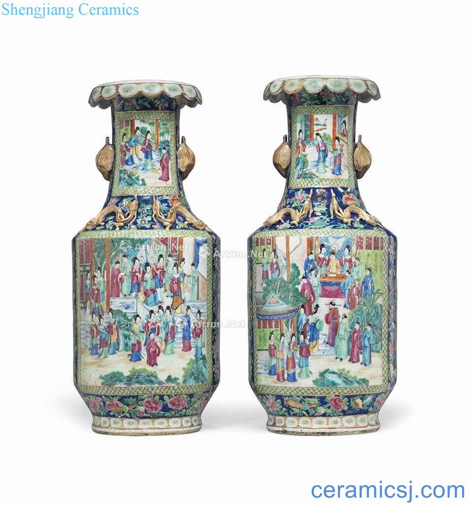 In the 19th century A PAIR OF LARGE CANTON FAMILLE ROSE VASES WITH GILT HANDLES