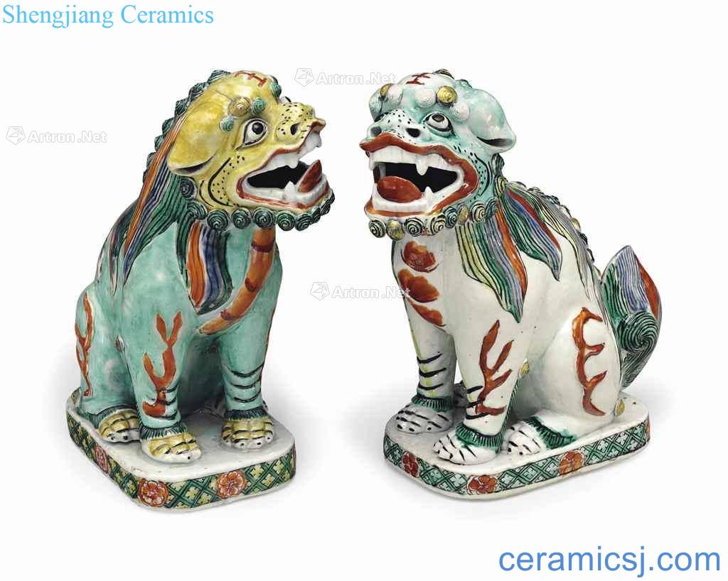 Kangxi period (1662-1722), the AN lead PAIR OF FAMILLE VERTE BUDDHIST LIONS
