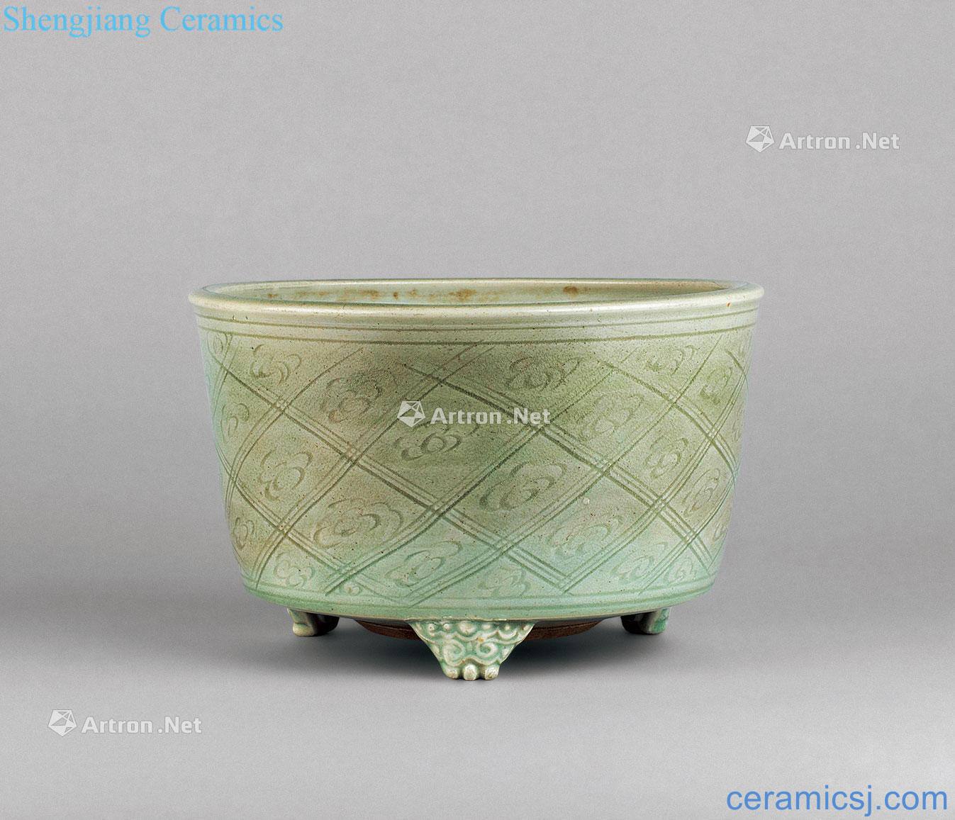 In the Ming dynasty Longquan celadon flower table lines three beast foot incense burner