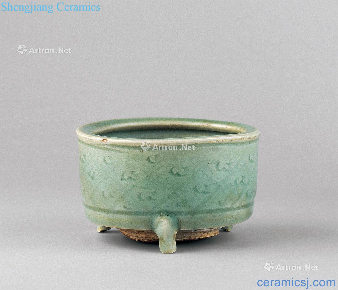 In the qing dynasty celadon carved flower grain three-legged censer