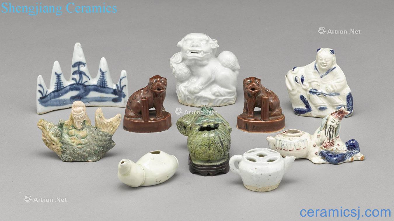 A GROUP OF TEN CERAMIC WATER DROPPERS AND WATER COUPES