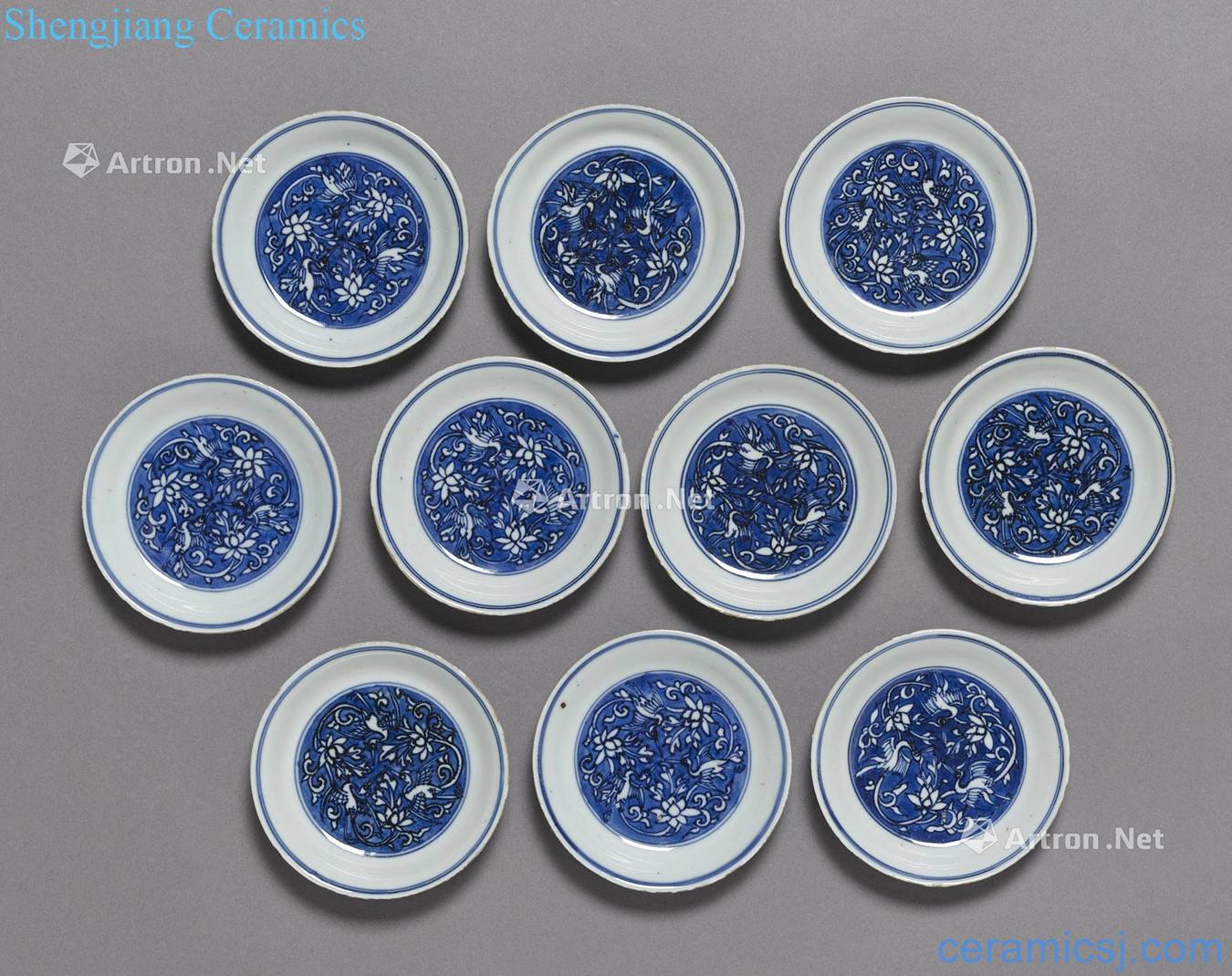 A SET OF TEN BLUE AND WHITE "CRANE" SAUCER DISHES