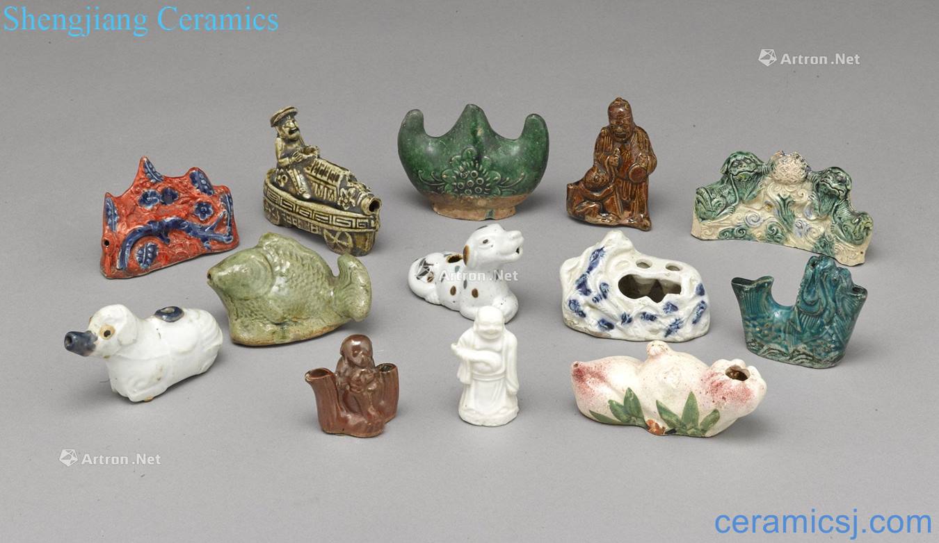 A GROUP OF THIRTEEN CERAMIC WATER DROPPERS AND WATER COUPES
