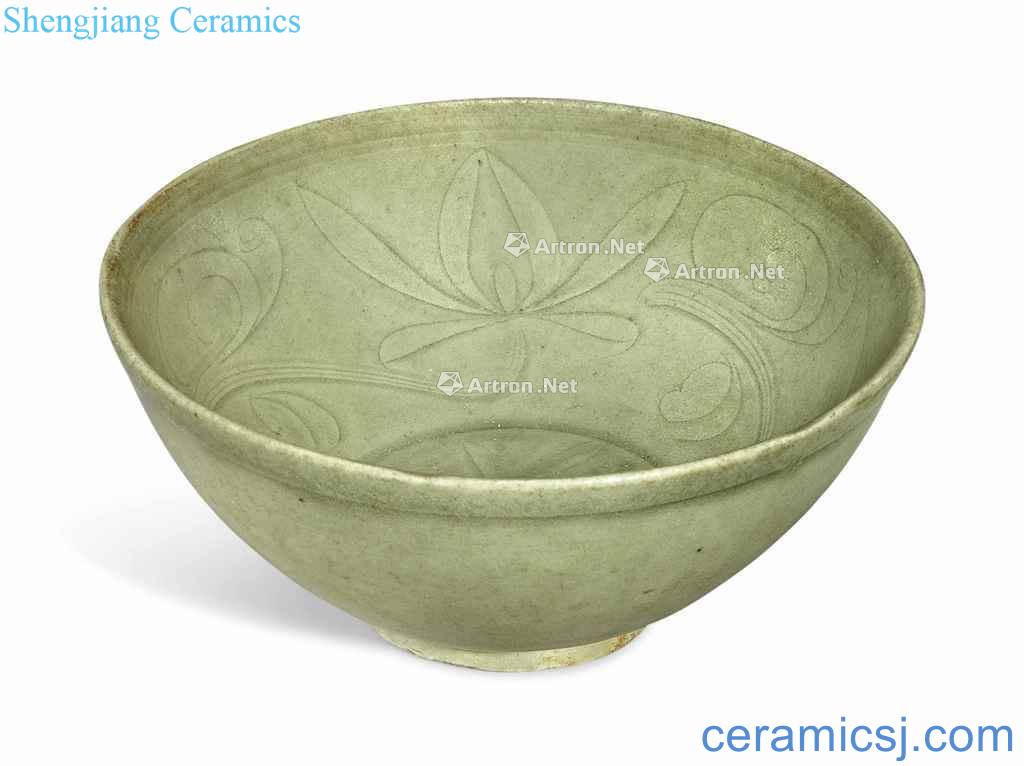 In the Ming dynasty (1368-1644), AN INCISED CELADON - GLAZED BOWL