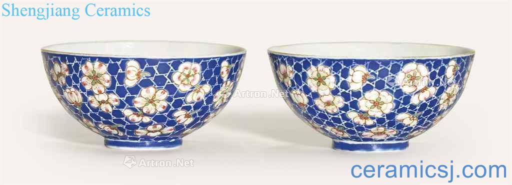 A PAIR OF BLUE - GROUND FAMILLE ROSE 'PRUNUS BOWLS