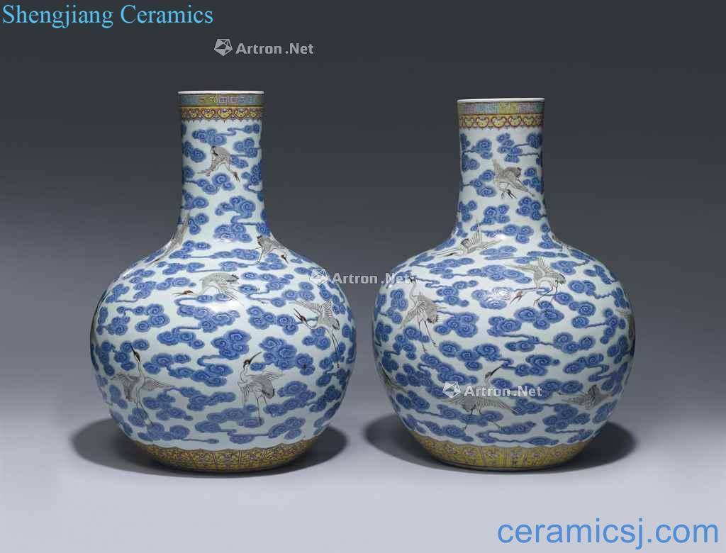 In the 19th century A PAIR OF FAMILLE ROSE 'CRANES' BOTTLE VASES, TIANQIUPING