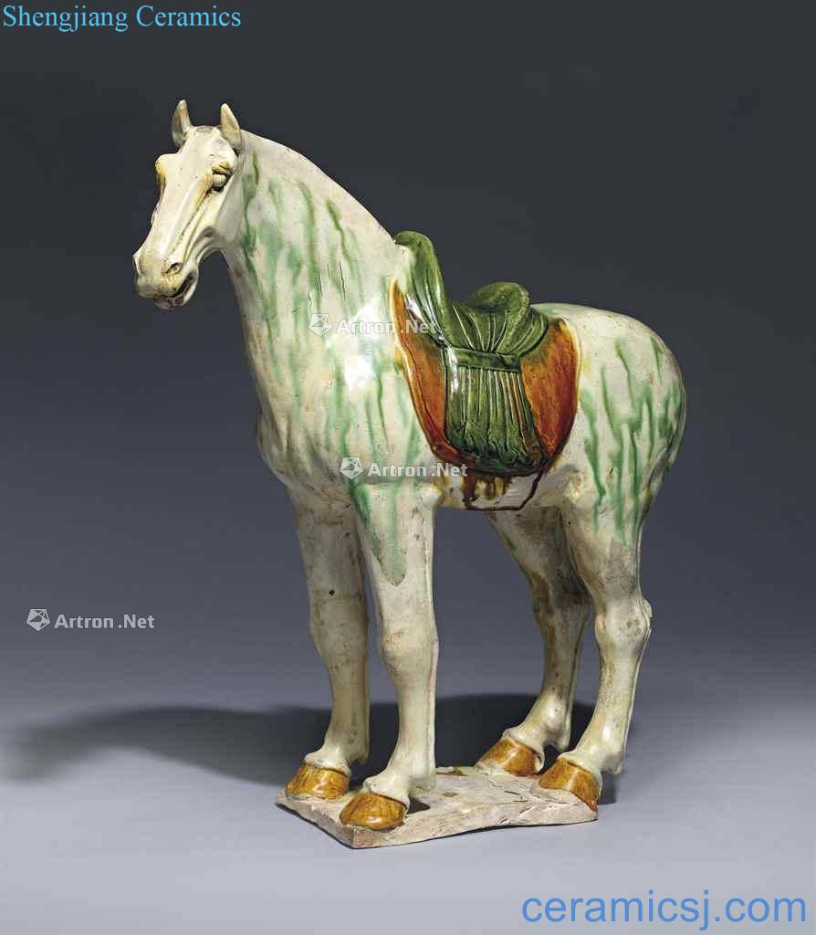The tang dynasty (618-907), A LARGE SANCAI - GLAZED POTTERY FIGURE OF A CAPARISONED HORSE