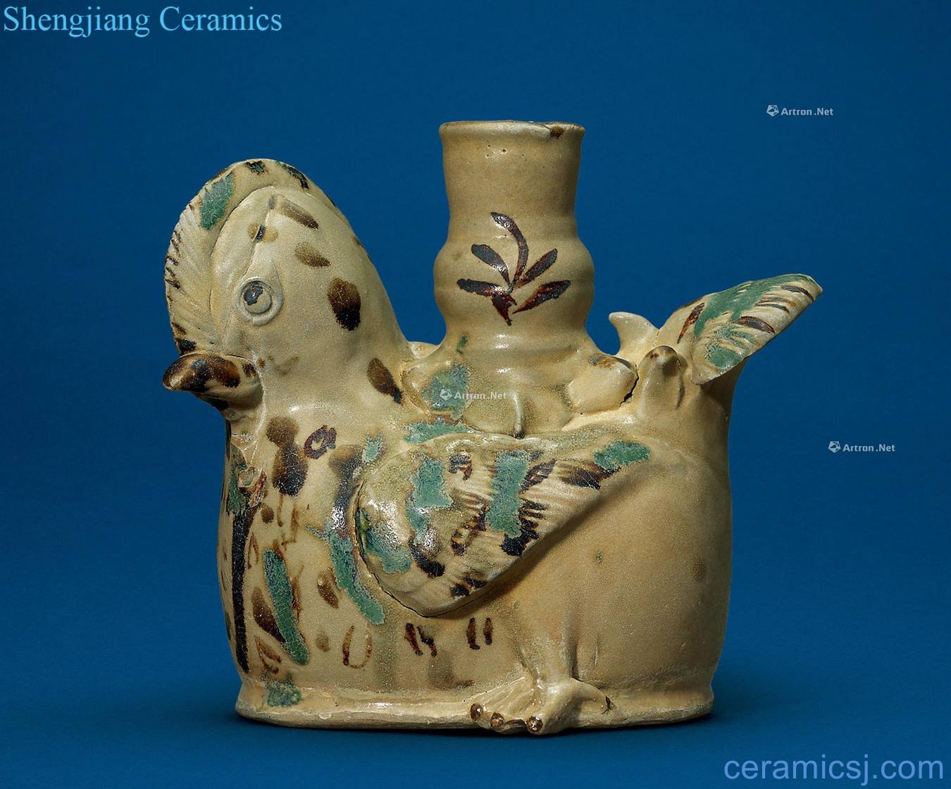 The tang dynasty Changsha kiln yellow glaze color green brown yuanyang shape gear