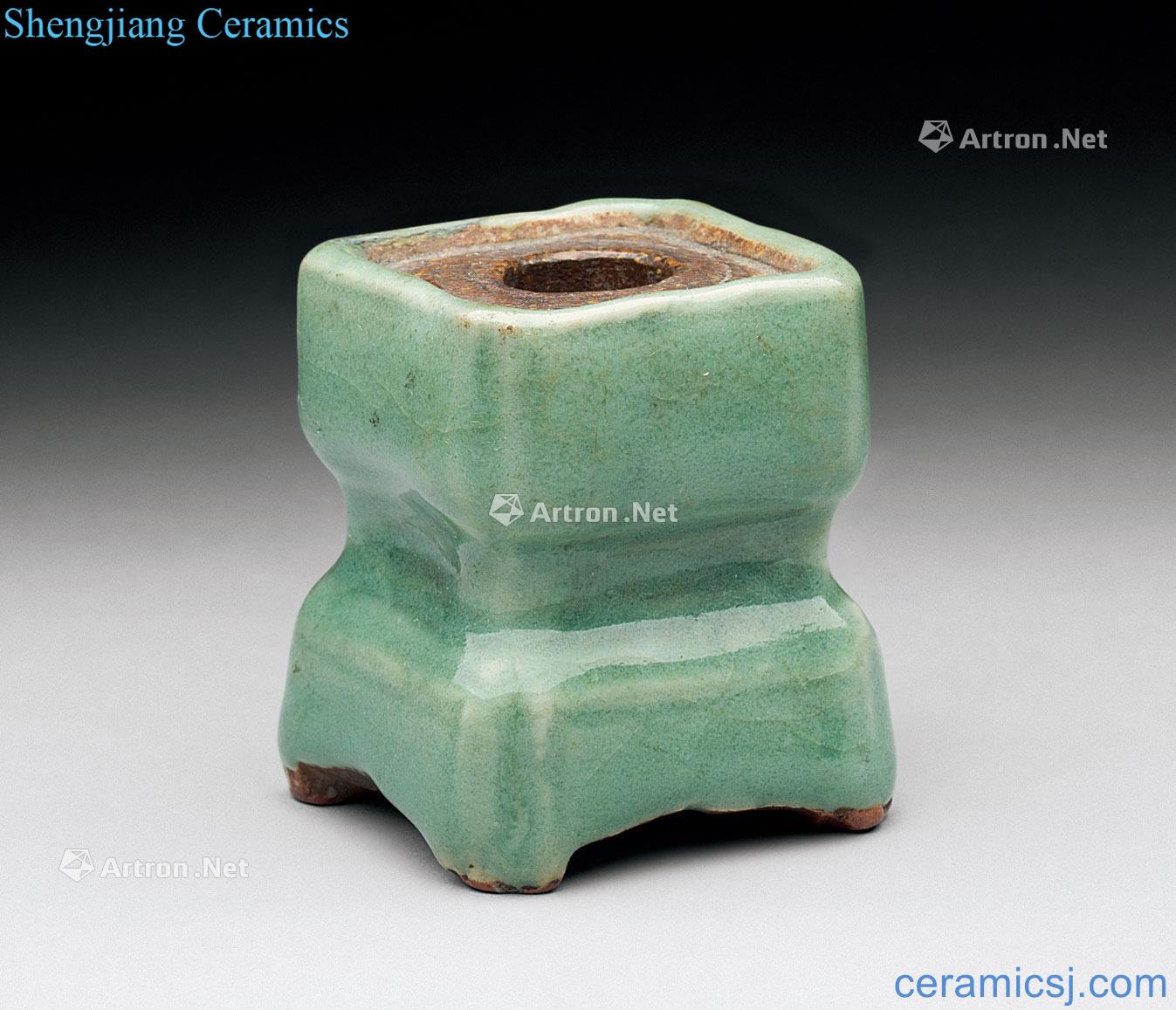In the Ming dynasty Longquan celadon four-legged incense inserted