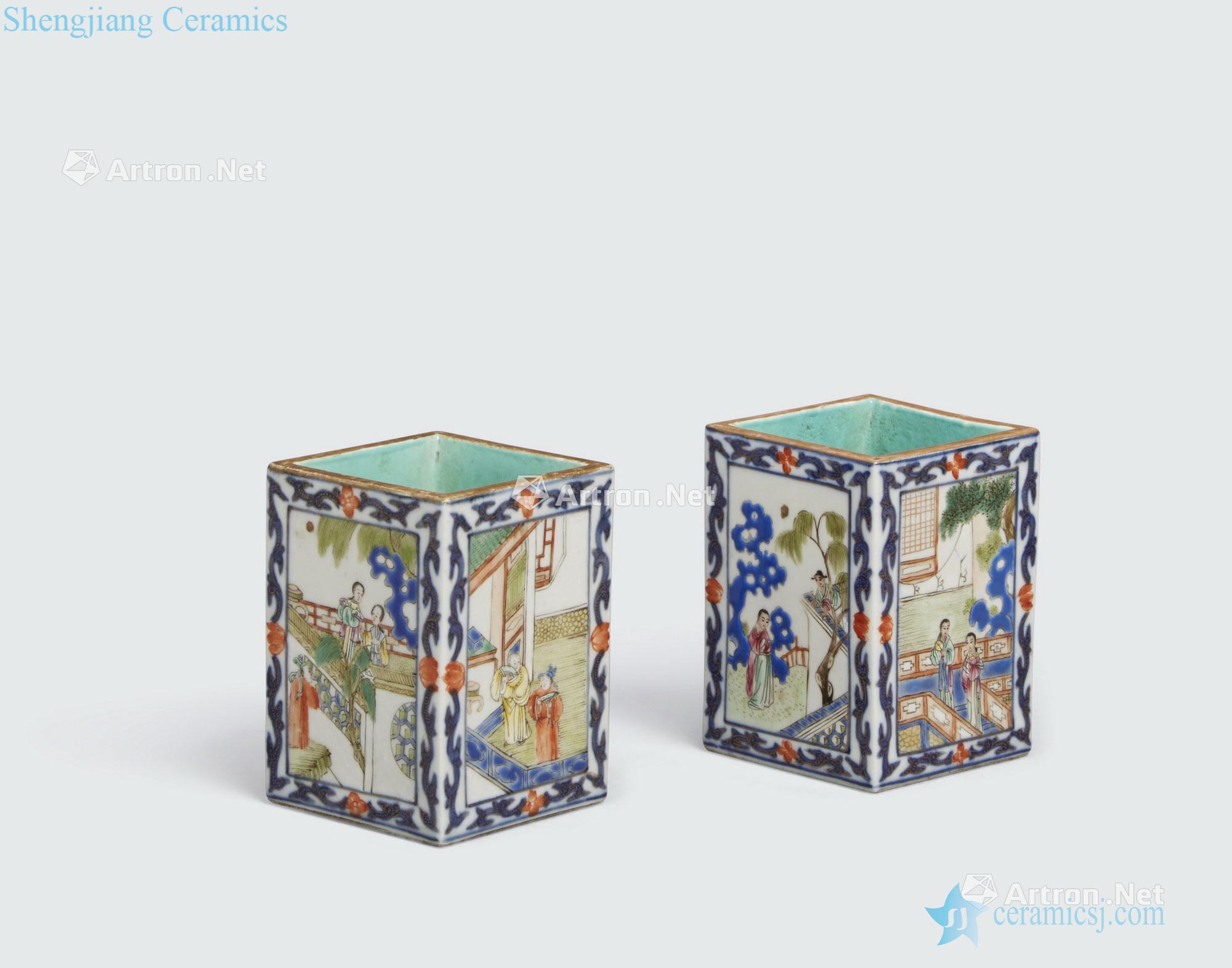 The 19 th century A PAIR OF UNDERGLAZE BLUE AND FAMILLE ROSE ENAMELED PORCELAIN BRUSH POTS