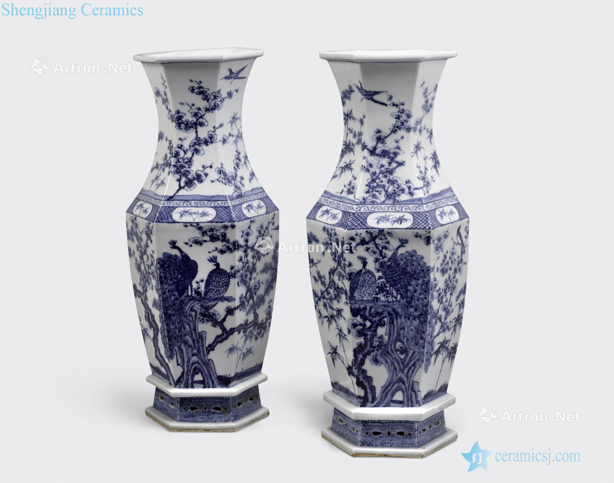 The 20 th century A PAIR OF BLUE AND WHITE HEXAGONAL SECTIONED - BALUSTER VASES