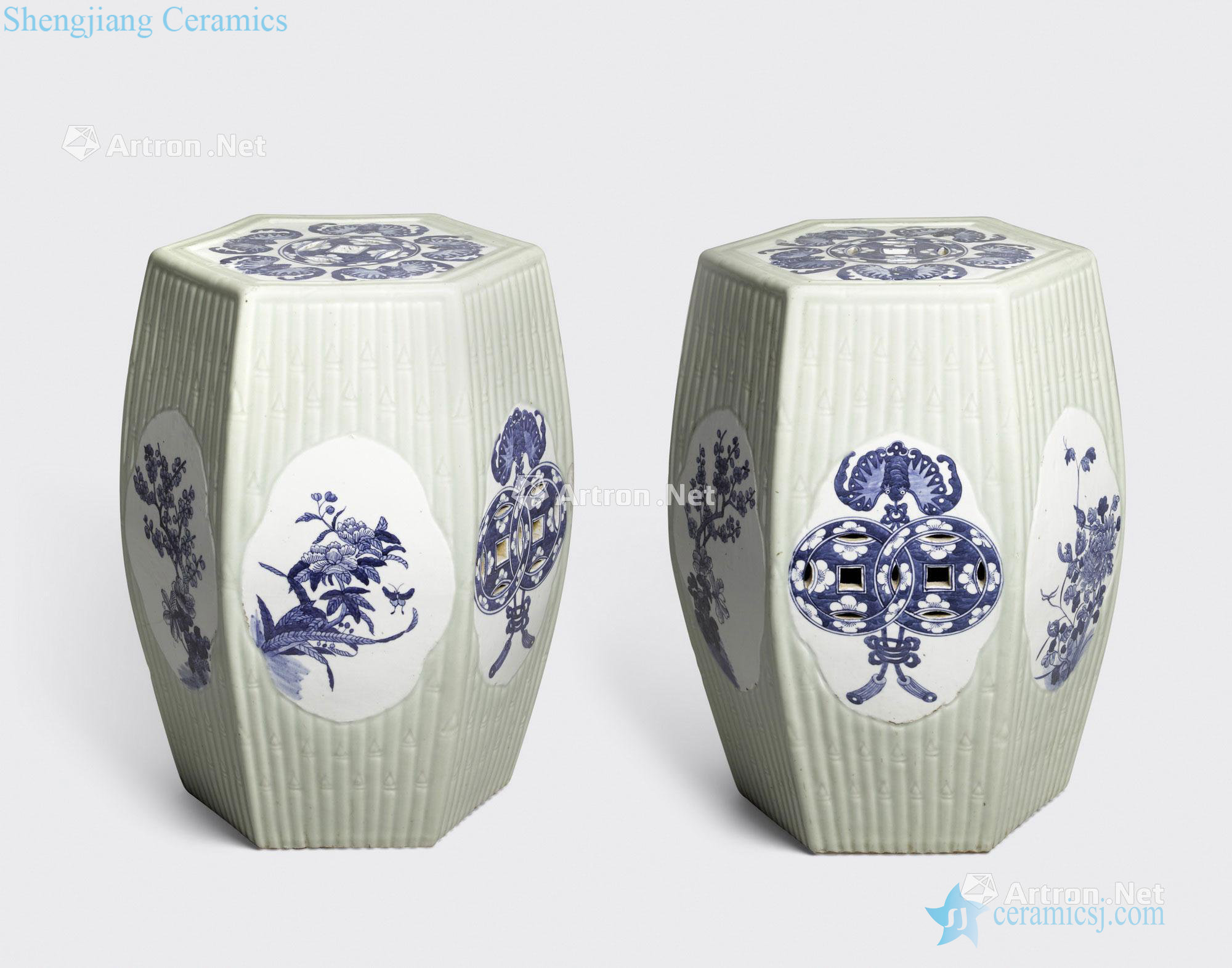 The 19 th century A PAIR OF CELADON GLAZED HEXAGONAL GARDEN SEATS WITH BLUE AND WHITE DECORATION