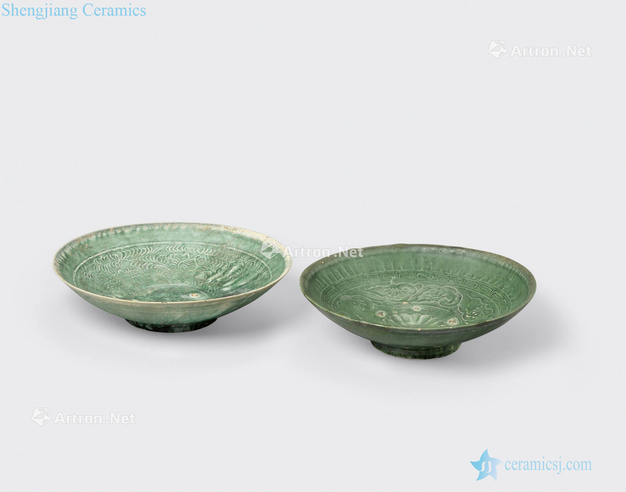 Tran - Le dynasties, 14 th/15 th century TWO GREEN GLAZED SHALLOW BOWLS WITH IMPRESSED DECORATION AND SPUR MARKS
