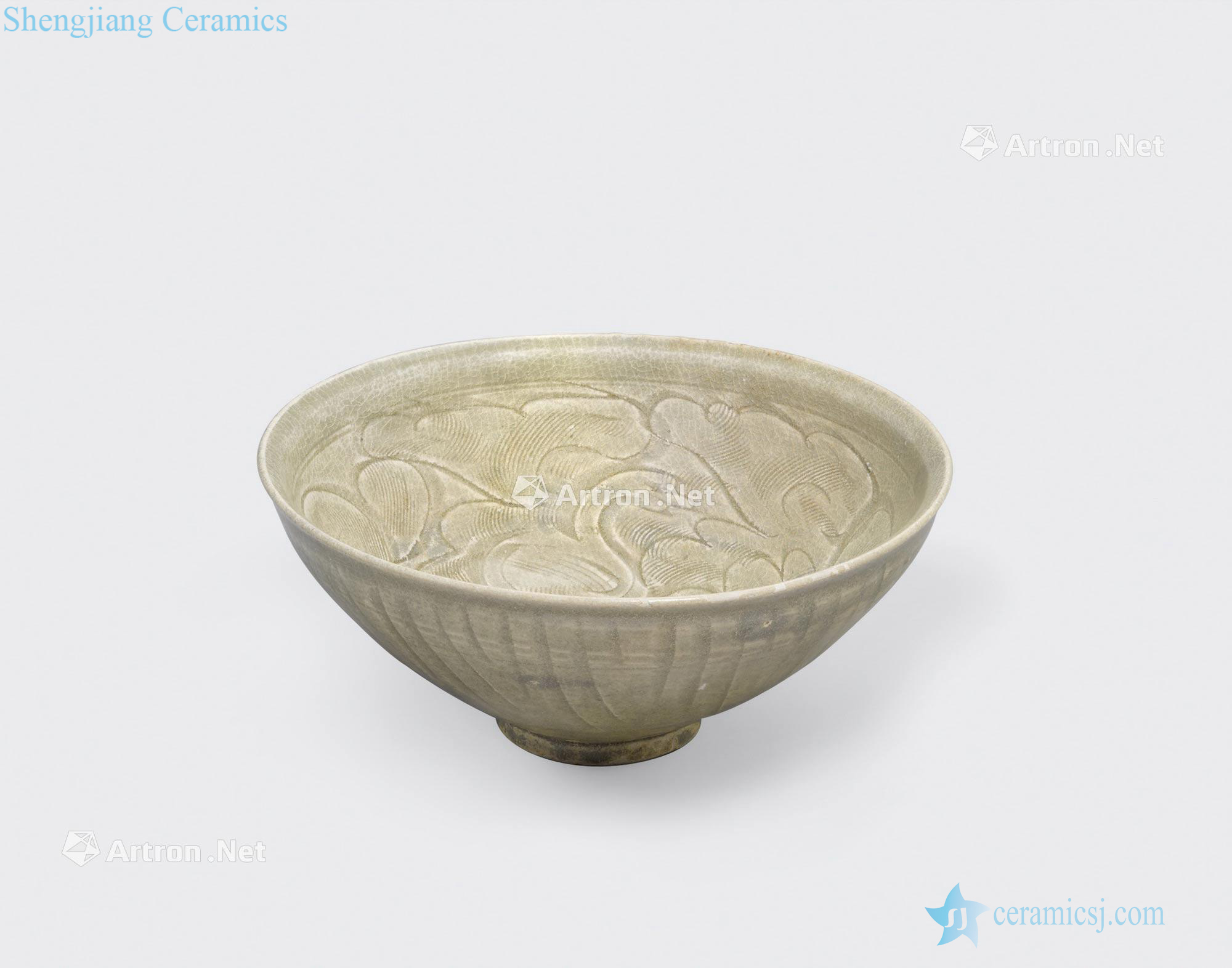 Tran dynasty, 13 th/14 th century AN OLIVE GREEN GLAZED BOWL WITH CARVED AND COMBED DECORATION