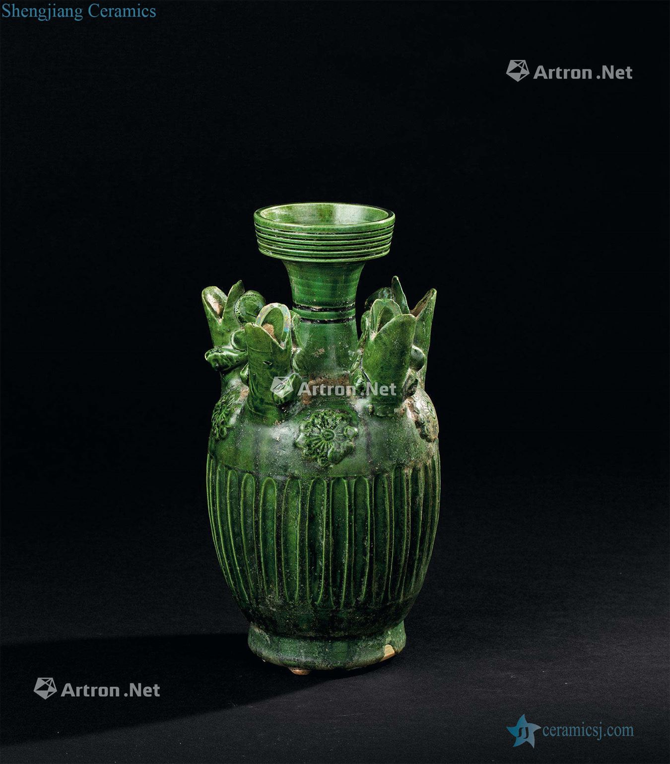 The tang dynasty (618-907) five hole bottle green glaze