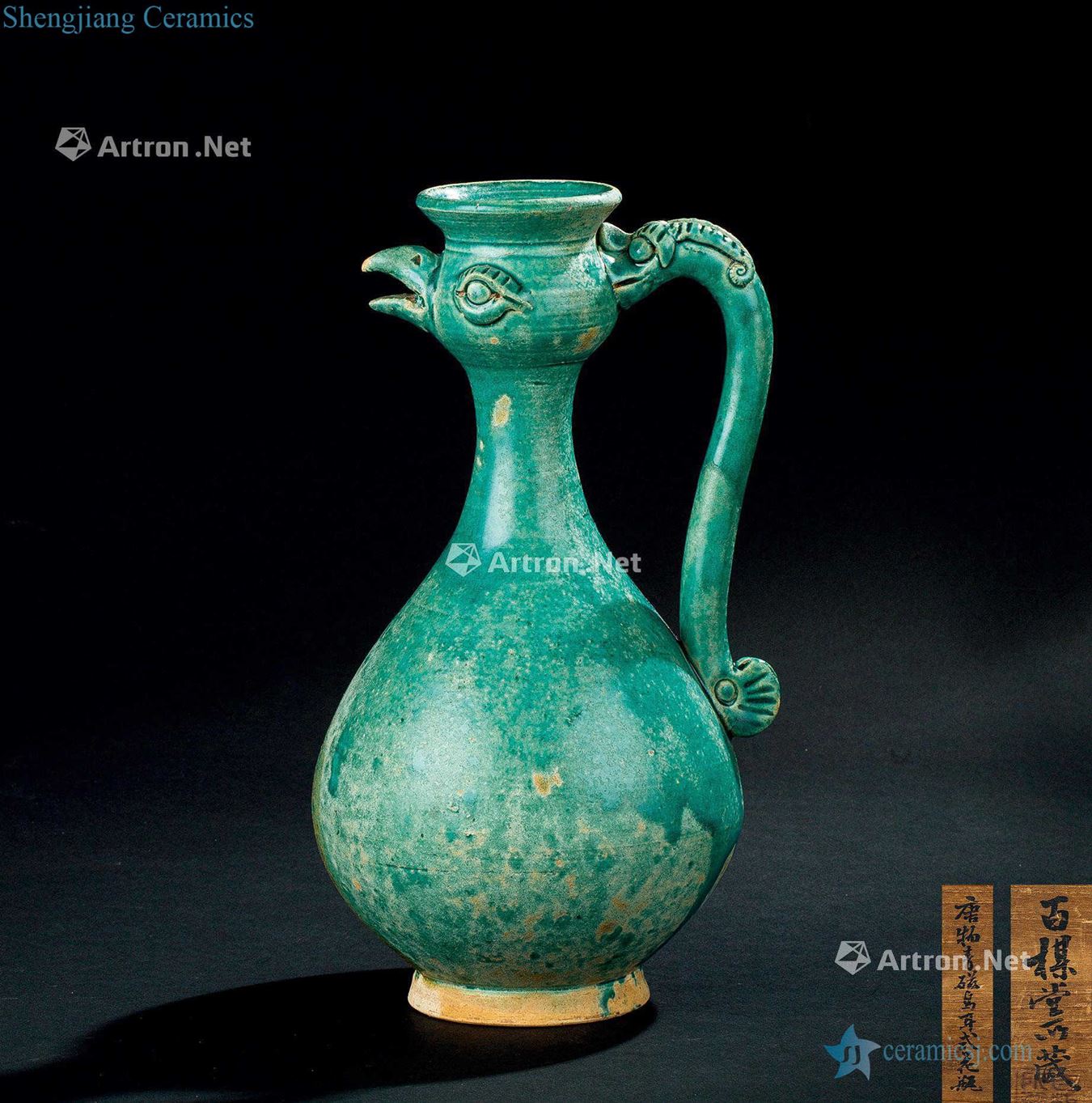 The tang dynasty (618-907) handle ewer green glaze chicken first dragon