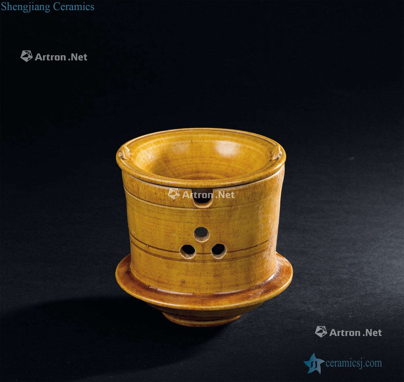 The tang dynasty (618-907) yellow glaze tea stove