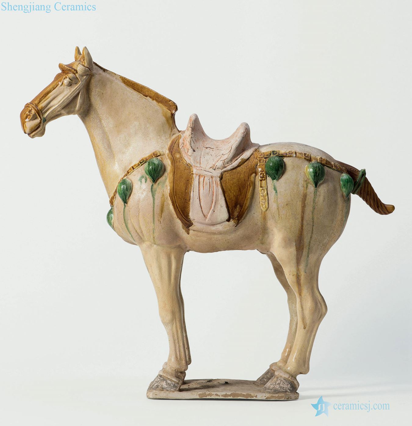 The tang dynasty White glazed three-color horse