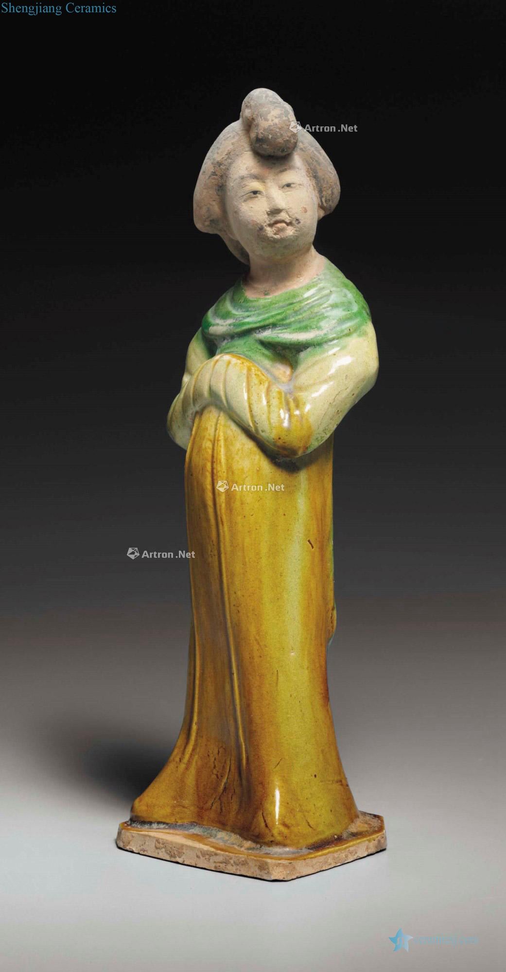 TANG DYNASTY (AD 618 ~ 907) A SANCAI - GLAZED POTTERY FIGURE OF A COURT LADY