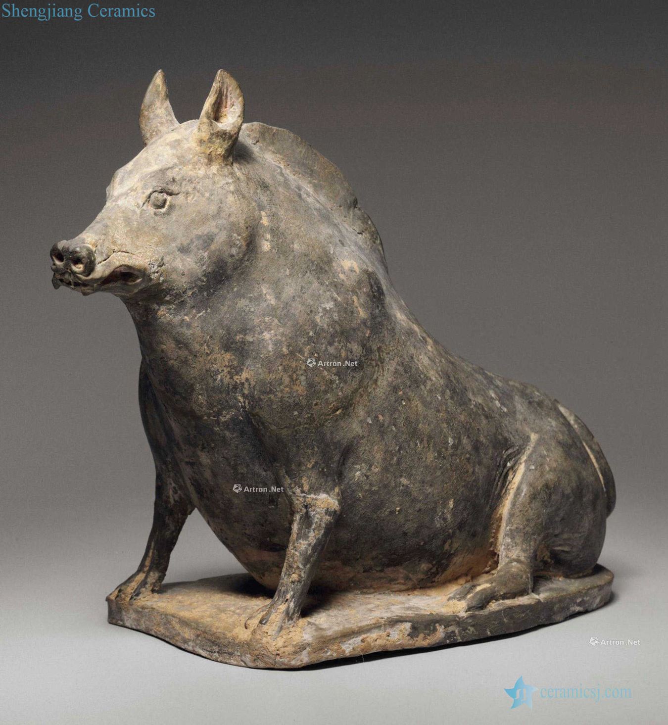 NORTHERN WEI DYNASTY, the EARLY 5TH CENTURY A GREY POTTERY FIGURE OF A SEATED BOAR