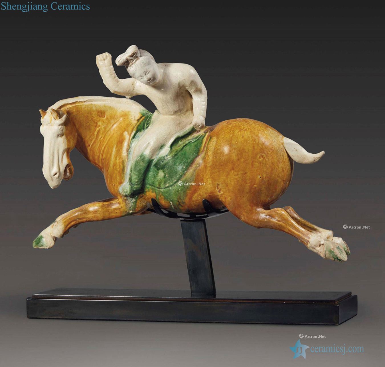 TANG DYNASTY (AD 618 ~ 618) is A VERY RARE AND IMPORTANT SANCAI - GLAZED POTTERY FIGURE OF A FEMALE POLO PLAYER
