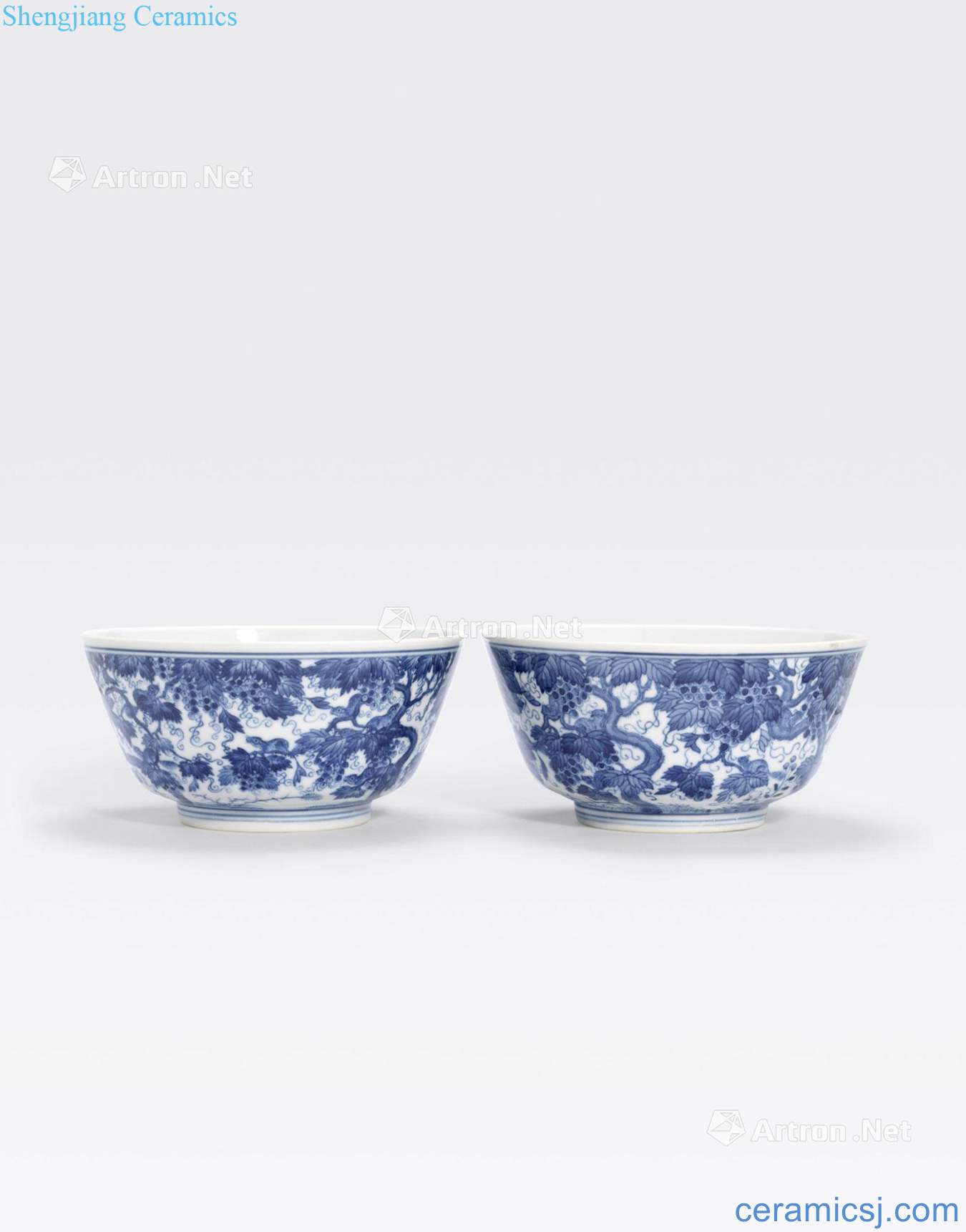 Yongzheng marks A PAIR OF BLUE AND WHITE BOWLS made WITH SQUIRRELS IN GRAPE VINES