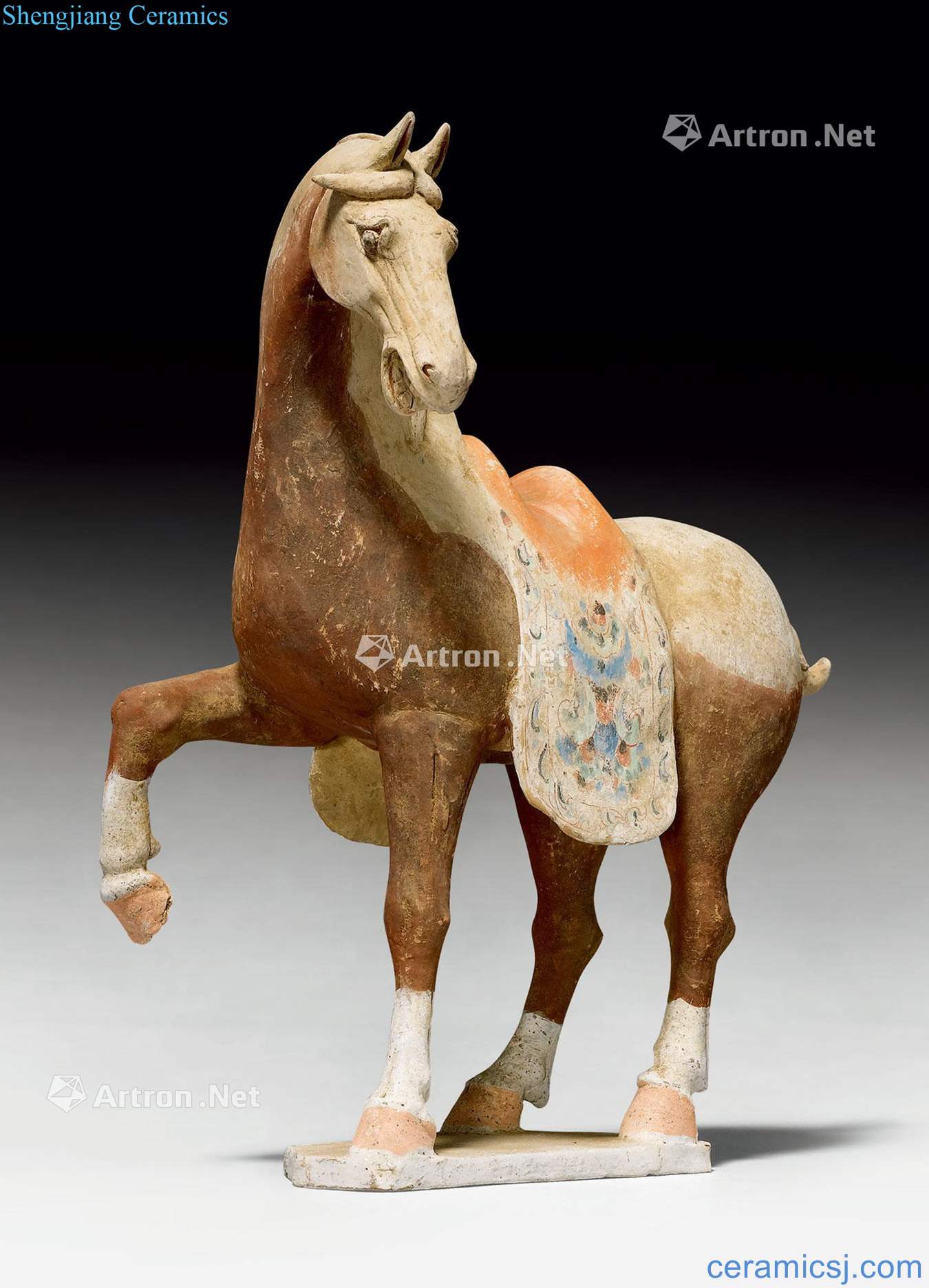 Tang dynasty made A POTTERY FIGURE OF A PRANCING HORSE.