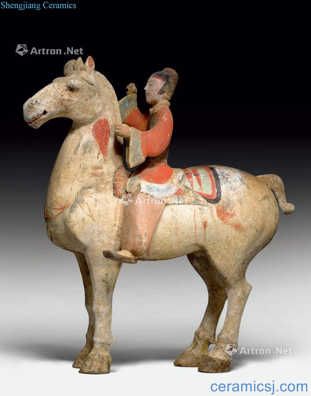 Han dynasty made A POTTERY MODEL OF A HORSE AND RIDER.