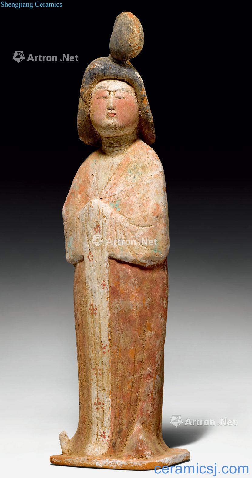 Tang dynasty made A POTTERY FIGURE OF A COURT LADY.