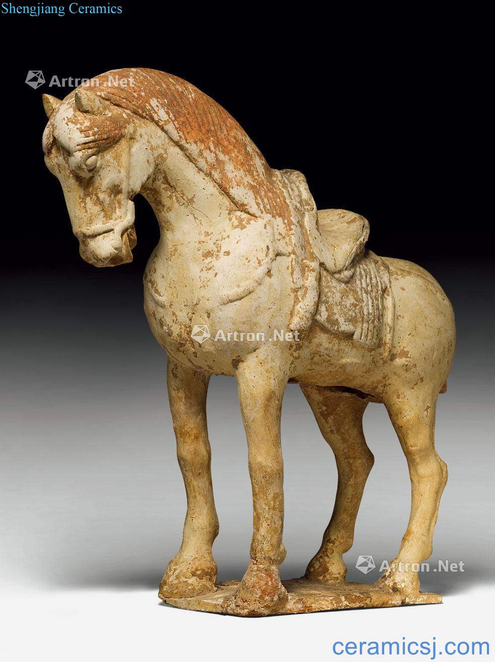 Sui AND Tang dynasty A CREAM - WHITE, RUSSET AND BLACK PAINT POTTERY HORSE.