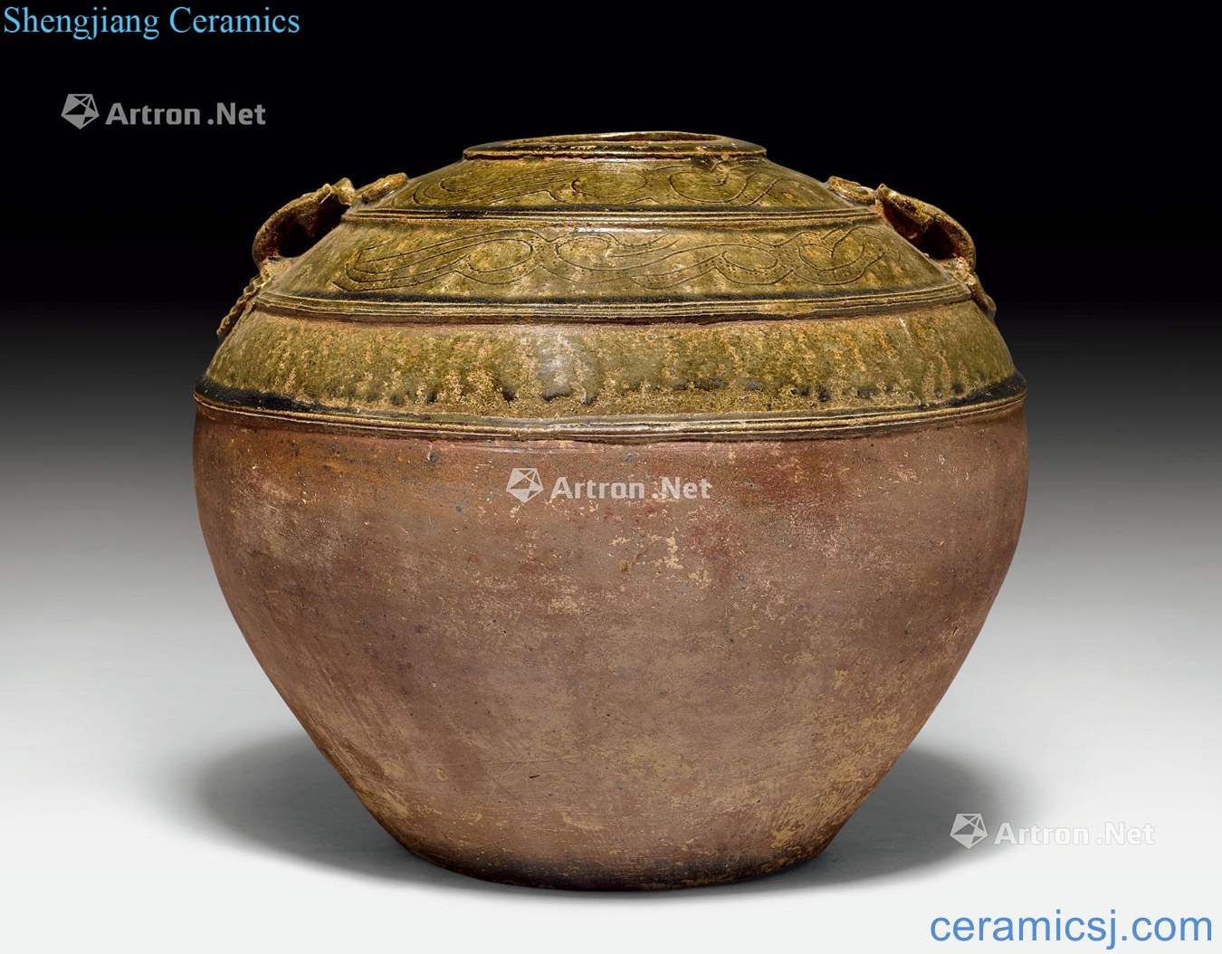 Eastern Han dynasty A LARGE STONE WARE ASH - GLAZED JAR WITH TWO AP - PLIED MASK HANDLES.