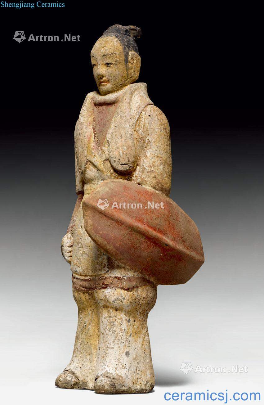 Northern Wei dynasty made A POTTERY FIGURE OF A WARRIOR WITH shields.