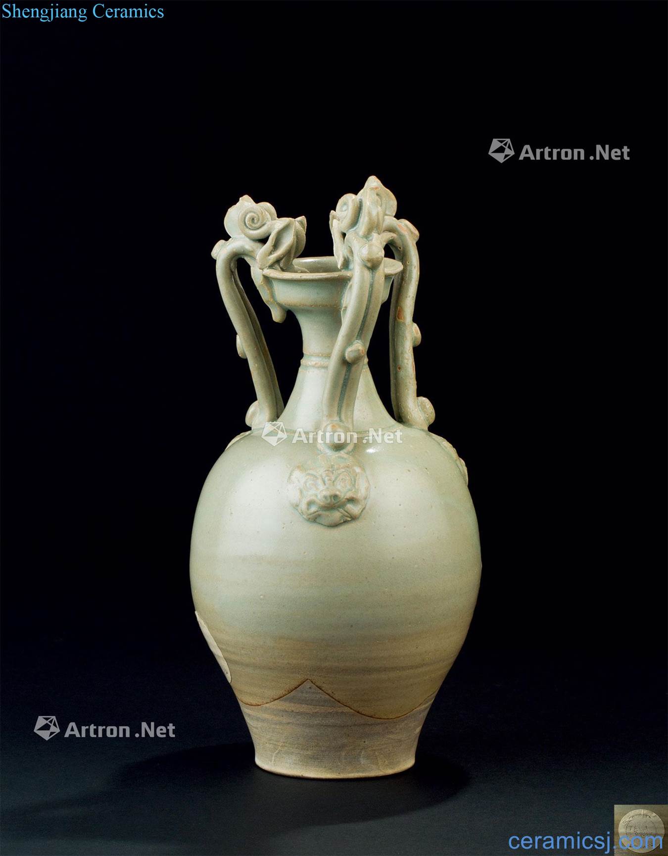 The tang dynasty (618-907) of the kiln celadon three dragon ear animal print bottle