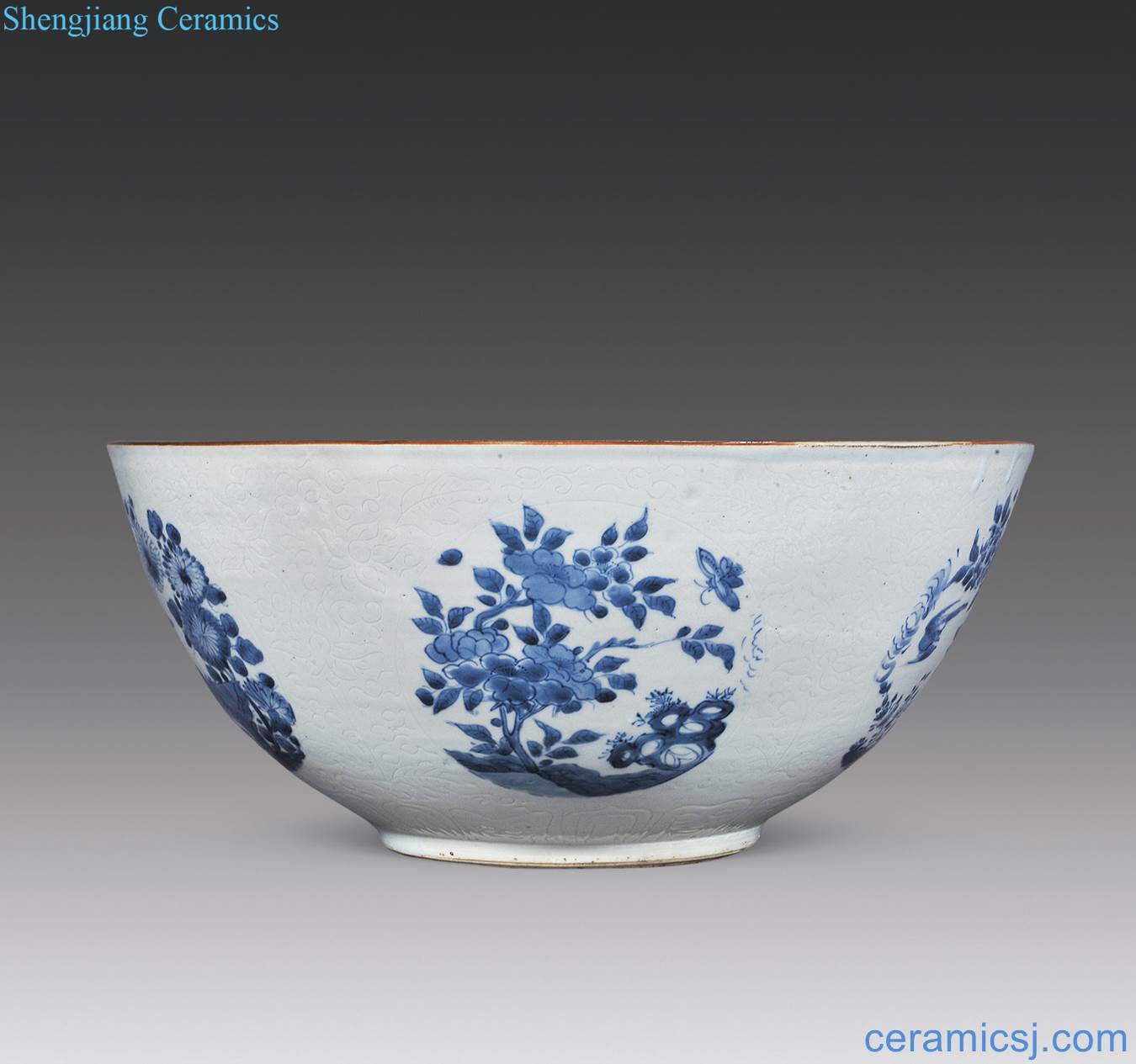 The qing emperor kangxi dark carved flower blue and white flowers and birds medallion lines large bowl