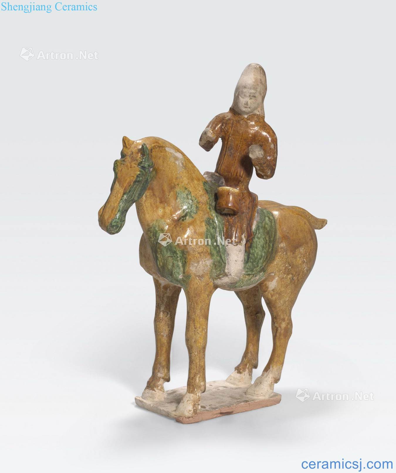 Tang dynasty A SANCAI GLAZED POTTERY MUSICIAN ON HORSEBACK