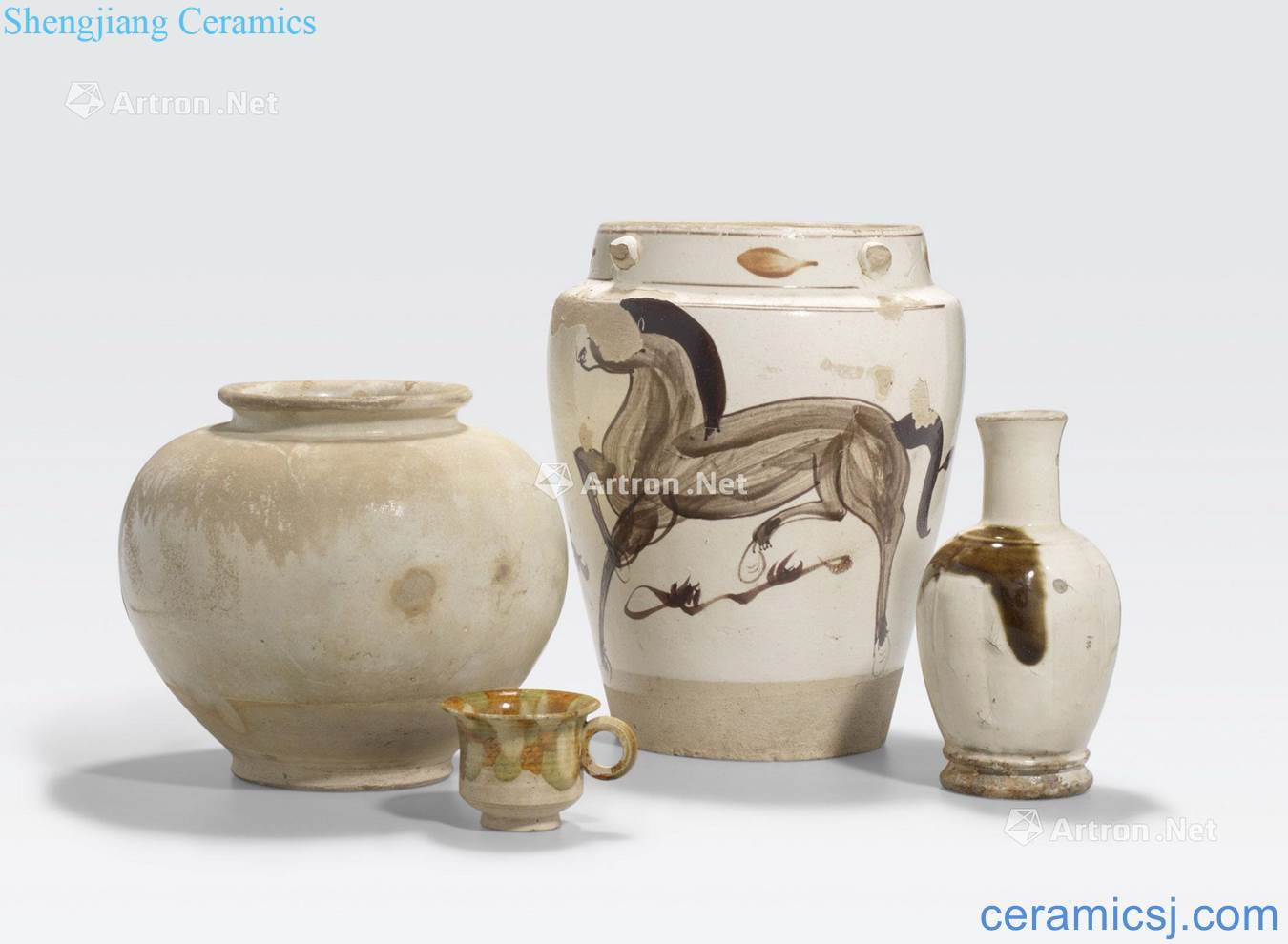 Tang and Ming dynasties A GROUP OF FOUR GLAZED CERAMIC CONTAINERS